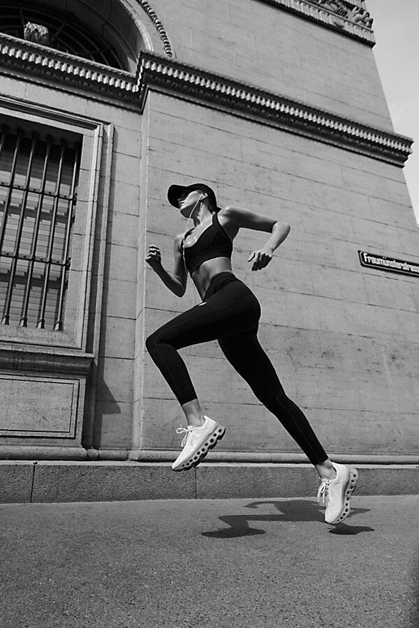 Female athlete running in city with Hype Utility Gears authentic running shoes